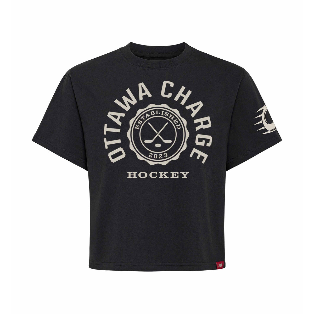 Front of a black short sleeve shirt. 'OTTAWA CHARGE' is written in a white arch of text around a circular emblem with crossed hockey sticks and 'ESTABLISHED 2023' inside with 'HOCKEY' below it. A white mono-color Ottawa Charge logo is on the left sleeve.