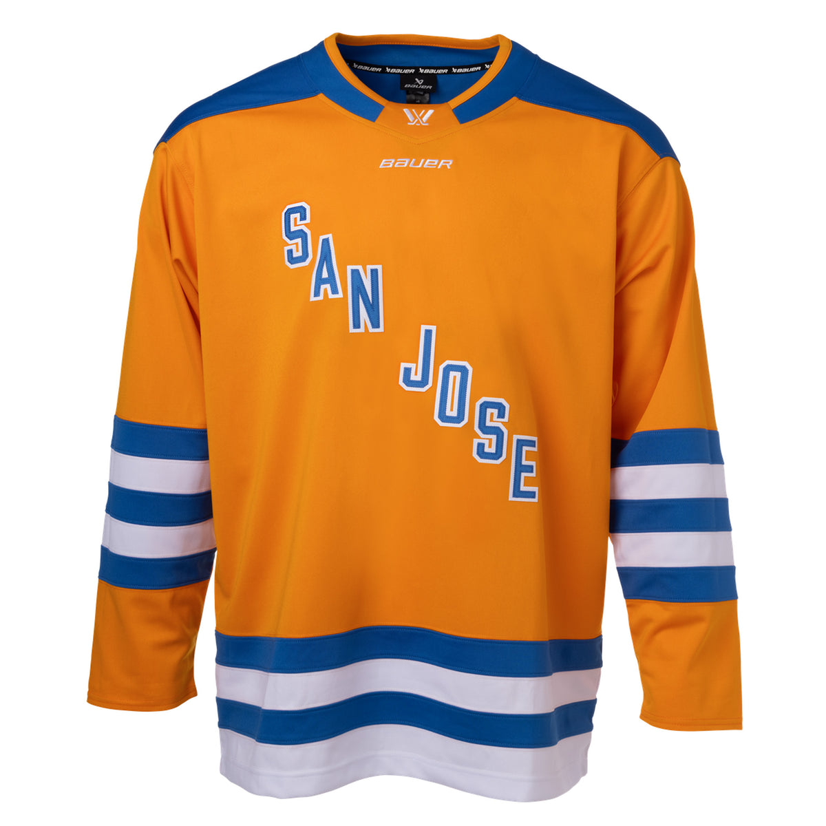 Front of an orange jersey with blue shoulder caps and blue and white stripes along the sleeves and bottom hem. In blue with white outlining is 'SAN JOSE' diagonally across the chest. The collar is blue with orange trim and color blocking on the front to showcase a white PWHL logo and a white Bauer logo below it.