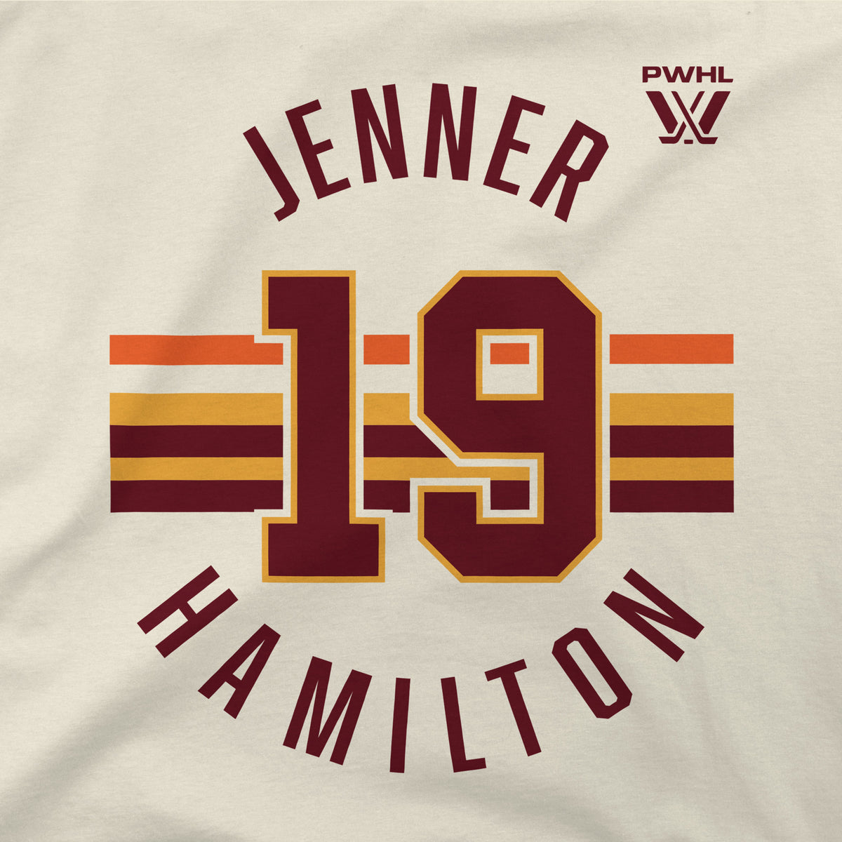 The front of a cream short sleeved shirt. Maroon, gold, and orange stripes are across the center with a maroon '19' outlined in gold on top of them. 'JENNER' in maroon is on top with the PWHL logo next to it. 'HAMILTON' is below in maroon.