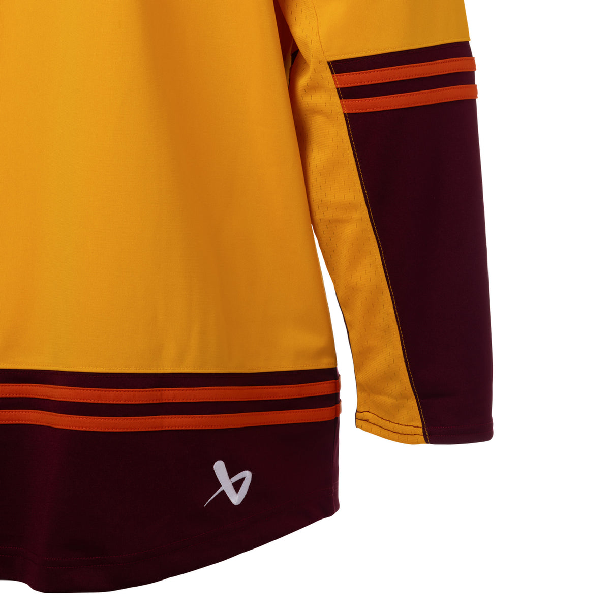 Back of a gold jersey with maroon color blocking on the sleeves and bottom hem with orange stipes on top. A white Bauer logo is above the bottom right hem. 