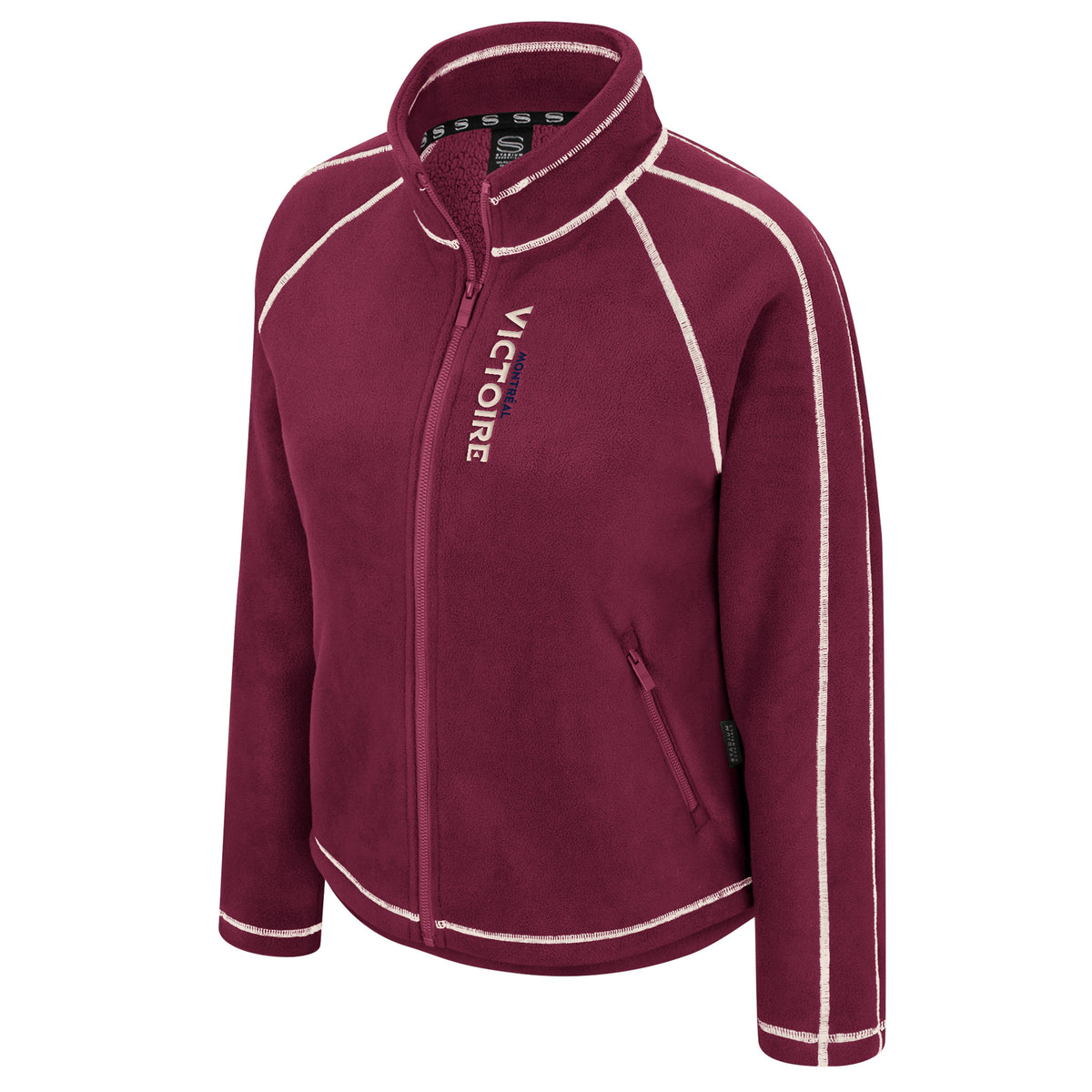 The front of a burgundy full-zip fleece jacket with white stitched seams along the arms, shoulders, and collar. Running along the zipper in the right chest is a small 'MONTREAL' in navy with a larger 'VICTOIRE' below it in cream. 
