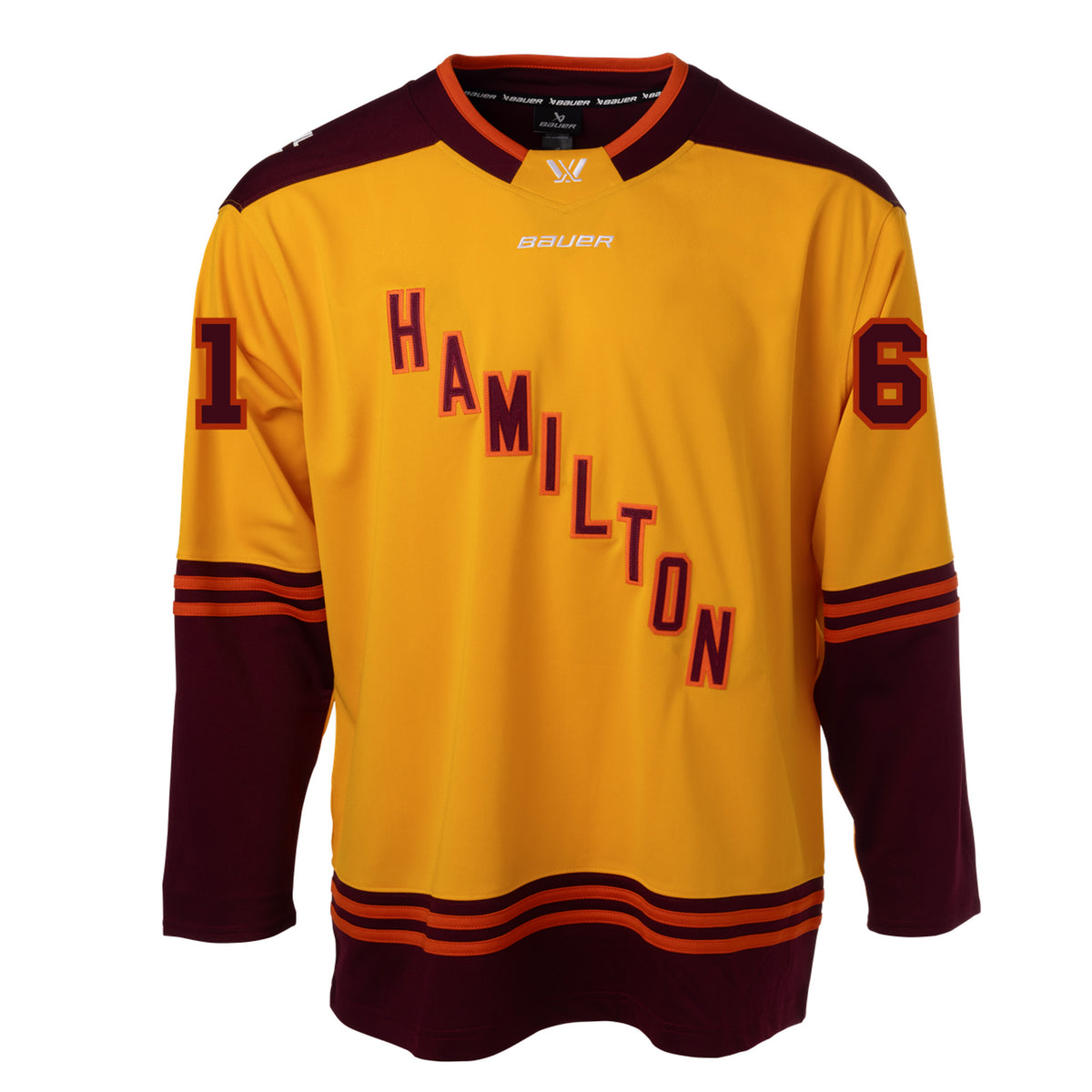 Front of a gold jersey with maroon shoulder caps. Maroon color blocking on the sleeves and bottom hem with orange stipes on top. 'HAMILTON' is in maroon with orange outlining diagonally across the chest with '61' on each sleeve. The collar is maroon with orange trim and a gold color block in front showcasing a white PWHL logo with a Bauer logo below it. 
